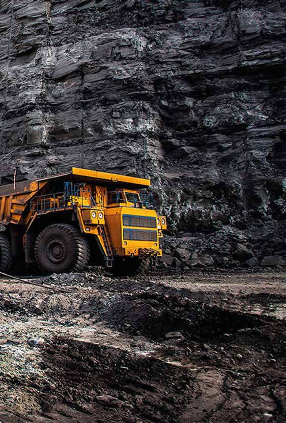 Haul truck at a gabbro rock face in the Sohar quarry